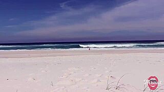 The naughty brunette gave me a blowjob on the beach in front of the bathers.