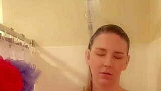 In the shower, she gets wet and starts touching herself sensually.