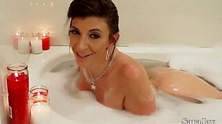 Sara Jay's huge clit contrasts with her mature body as she masturbates naked in lingerie.