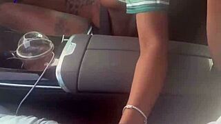 In the car, she plays with a big black cock, giving a blowjob outdoors