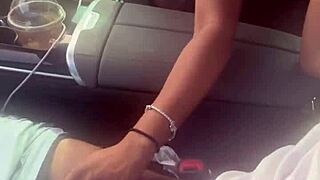 In the car, she plays with a big black cock, giving a blowjob outdoors