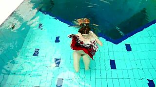 I dive underwater with hot Polish teen Marketa in bikini. we flash petite tits at public pool and beach