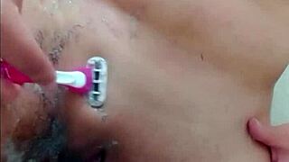 hot young woman in the shower getting waxed in the bathroom