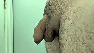 hey, check out this amateur guy masturbating with his big cock hidden behind the door