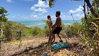 This sexy fit woman enjoys a beautiful day outdoors on the Brazilian beach with friends