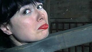 Bound BDSM sub experiments with fire in intense session