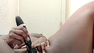 The ebony babe with big tits masturbates her sweet clit using toys to orgasm