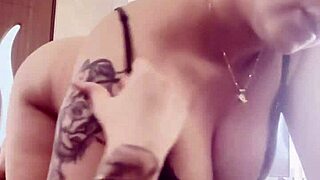 She casually pulled her big boobs out from the black bra while lounging around at home