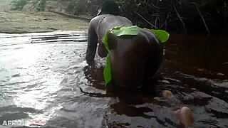 watch this busty african beauty with huge tits and ass grinding in a ritual dance then cleansing her thick body in sacred outdoor water
