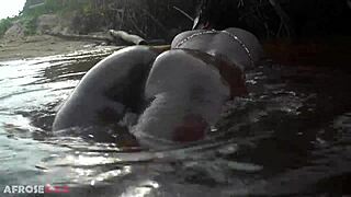 watch this busty african beauty with huge tits and ass grinding in a ritual dance then cleansing her thick body in sacred outdoor water