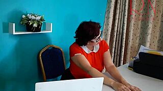 Naughty French secretary masturbates pussy under office desk on retro security camera