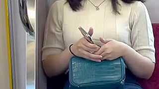 Chinese babe flashes panties on crowded train.