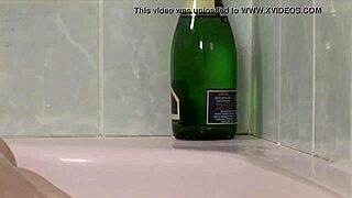 Twins shove heel bottle in wet pussies!