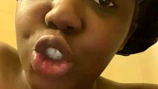 young ebony teases wet pussy and ass in shower